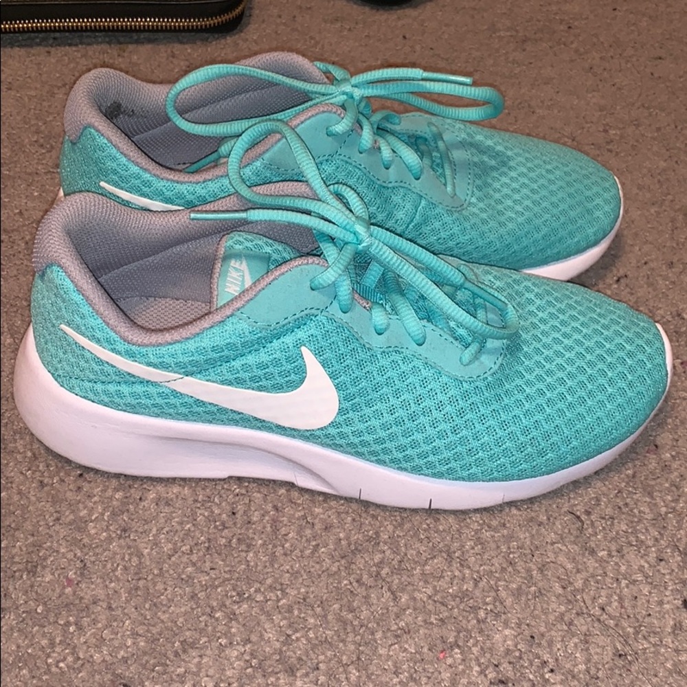 Teal Nike Tanjun sneakers